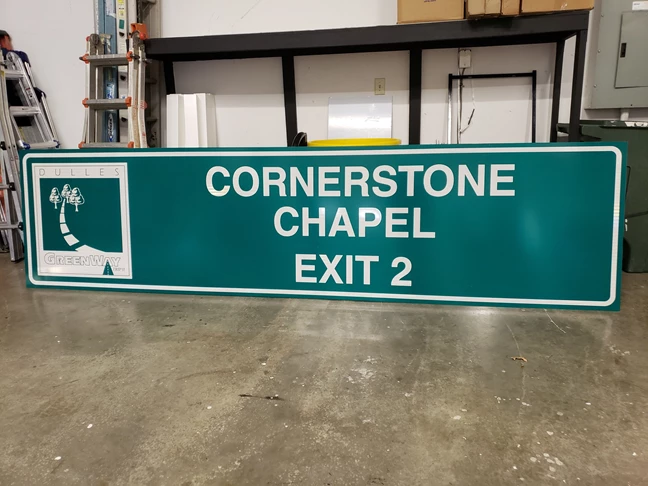Dulles Greenway exit sign for Cornerstone Chapel. This reflective highway sign is 12 feet long and 3 feet tall.