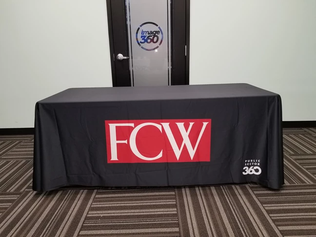 Public Sector 360 needed a simple yet elegant table throw with their logos printed. This is the 6ft size and its made from a smooth washable fabric.